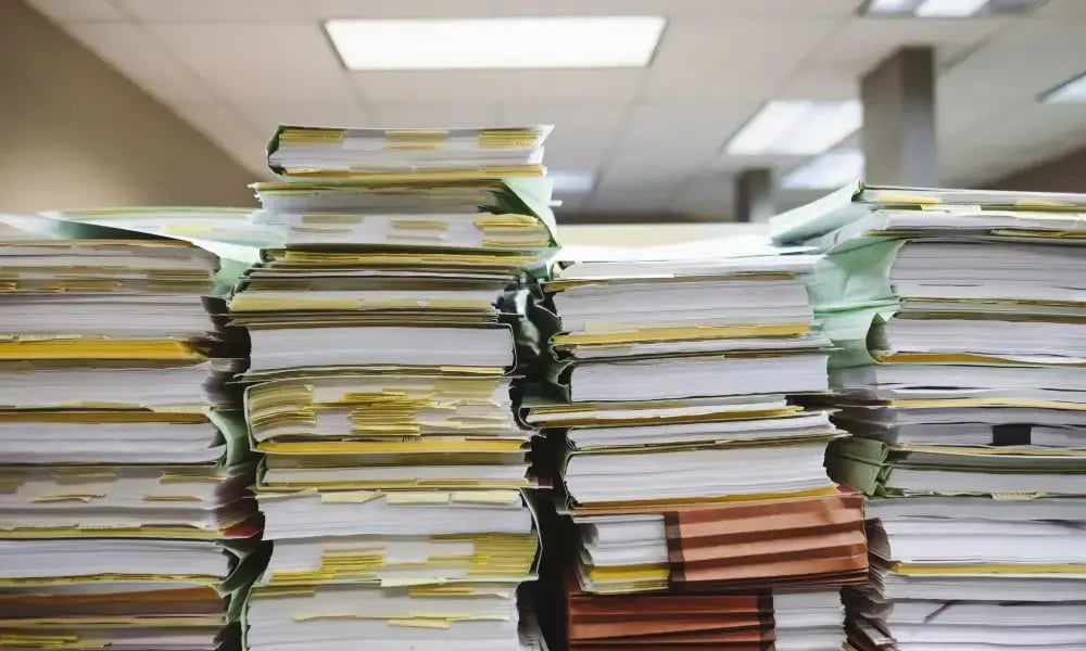 paperwork stacking up paperwork stacking up