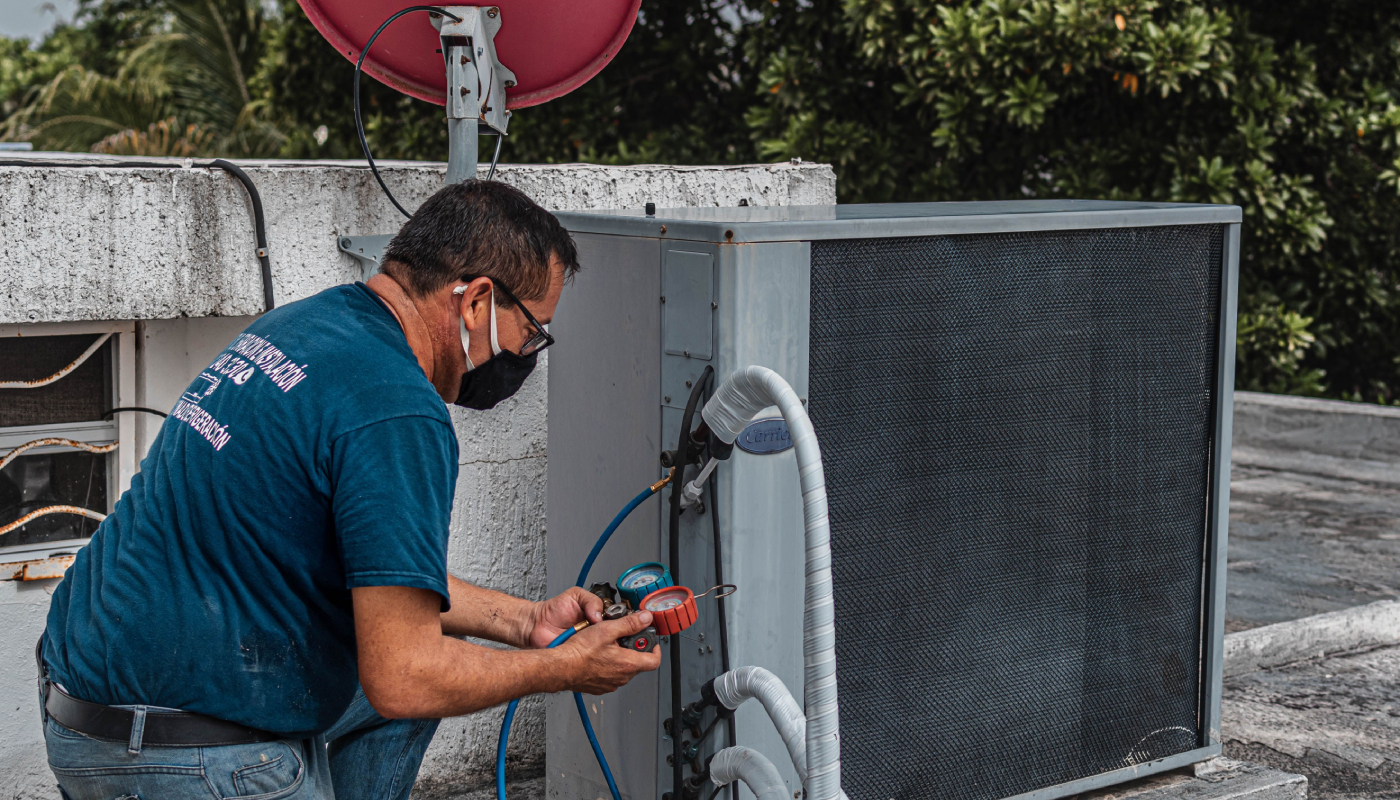 technician-repairing-ac-unit