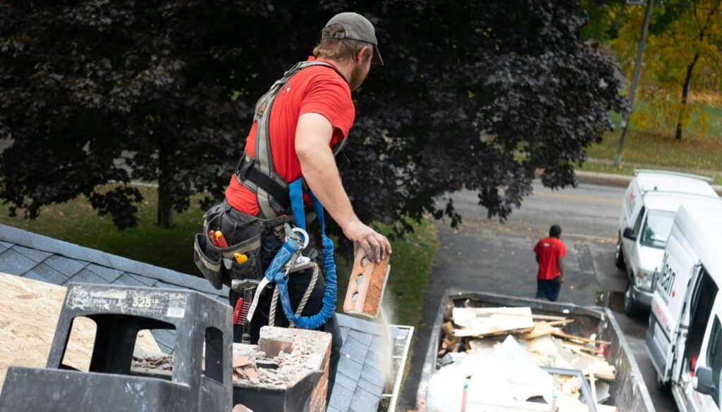 man working on roof