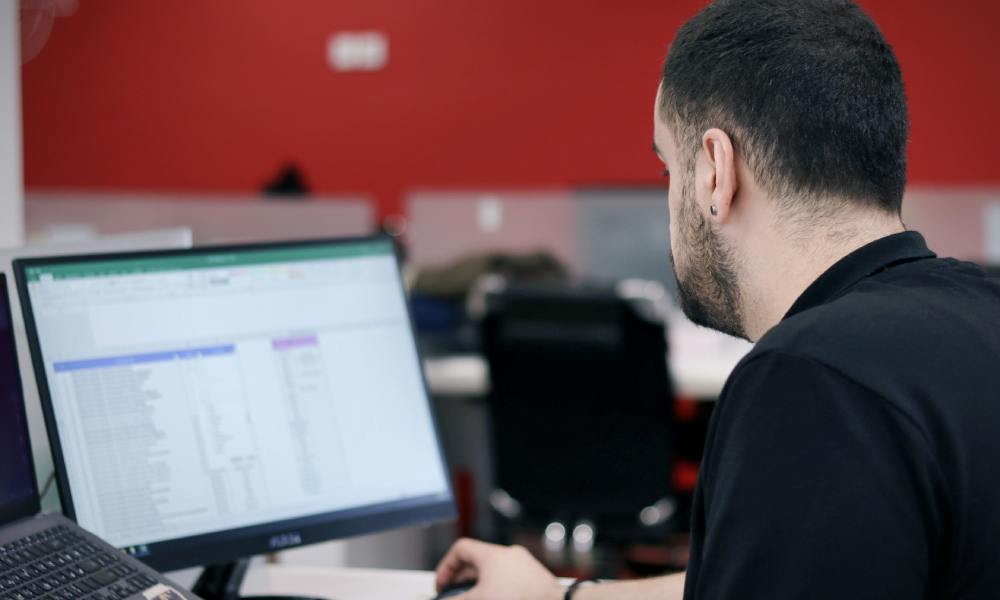 man using laptop in office