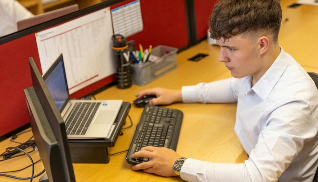 employee using computer in office