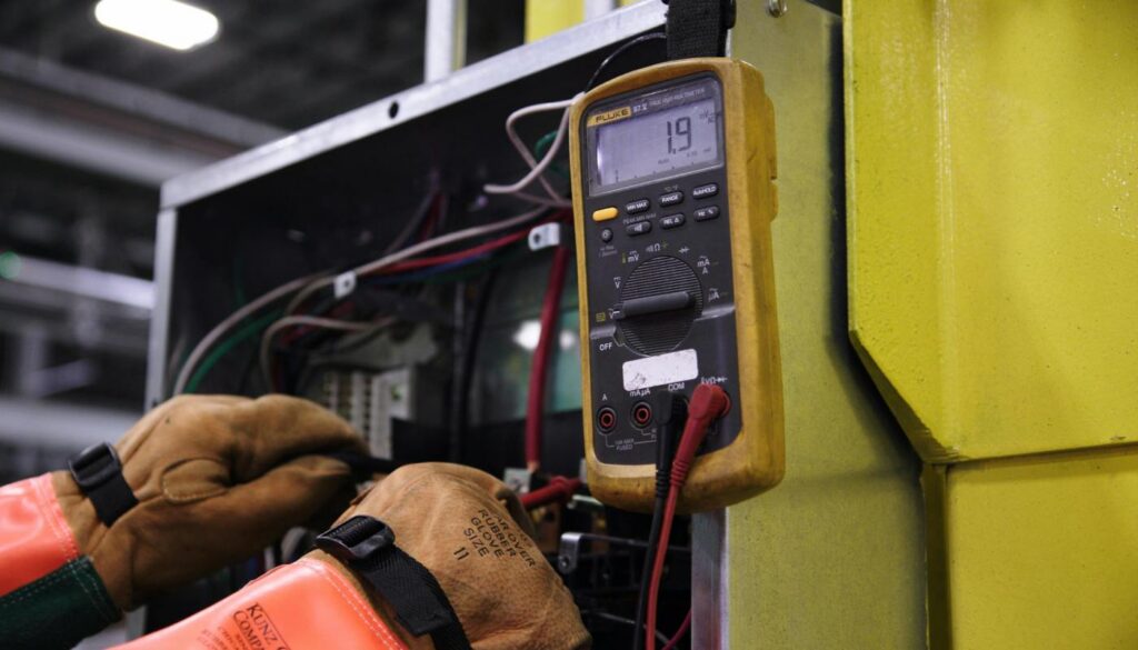 man fixing electrical box